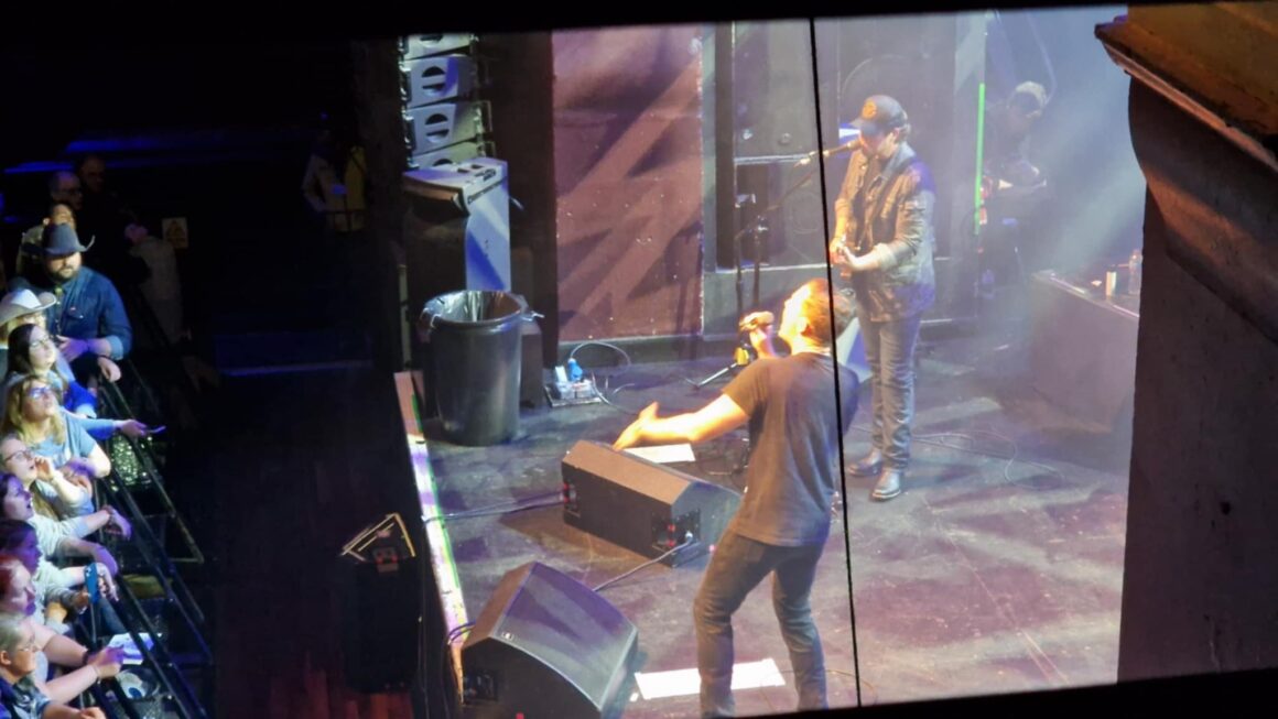 Picture of the stage from the right side, Scotty is on stage performing
