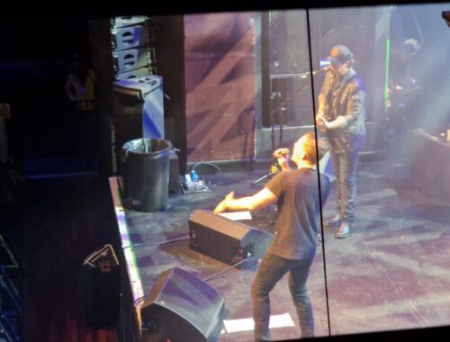 Picture of the stage from the right side, Scotty is on stage performing
