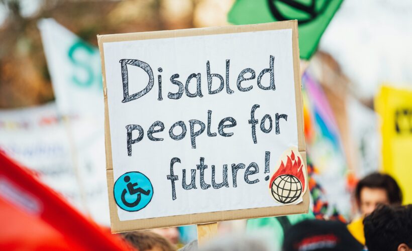 A banner at what looks like a parade or protest that says 'Disabled people for future'