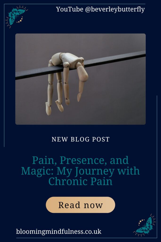 a wooden doll is hanging over a wire against a grey background to represent Pain, Presence, and Magic: My Journey with Chronic Pain