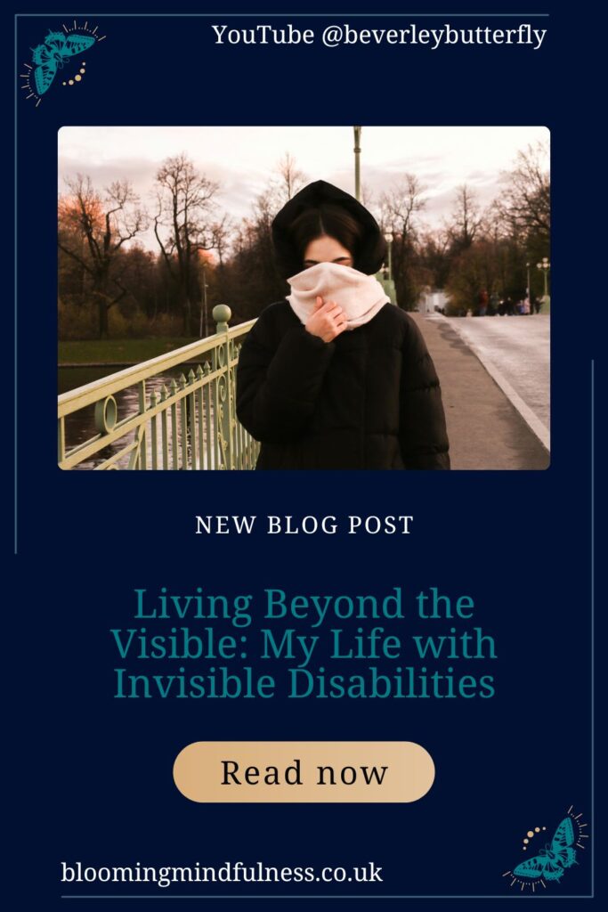 A woman in seen on a bridge she has a black coat on and her hood is up she has a thick pink scarf covering her face to represent My Life with Invisible Disabilities