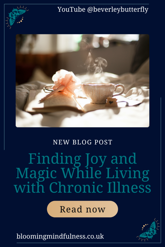 Sunlight falls on an open diary, and a pen with a peach flower on the end, alongside it is a cute teacup with a hand drawn heart on a small card beside it. Steam rises from the cup to represent Finding Joy and Magic While Living with Chronic Illness