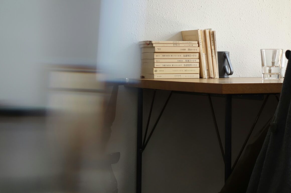 Stacked books on a desk