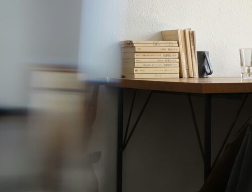 Stacked books on a desk